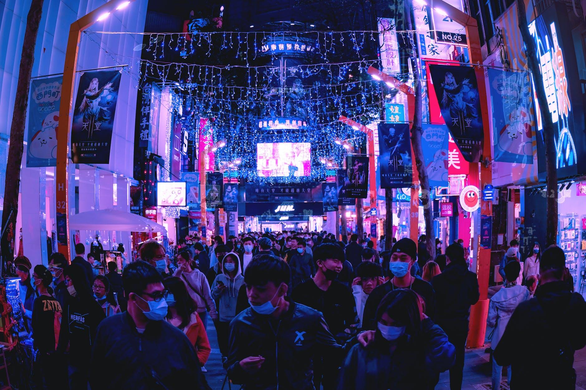 crowd of people on a busy street at night