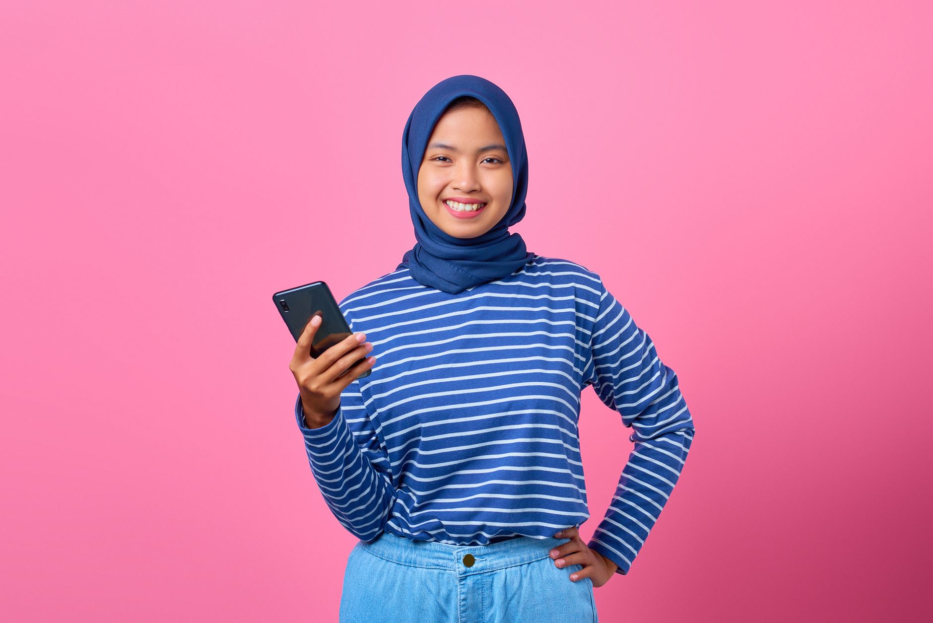 a woman holding a cellphone