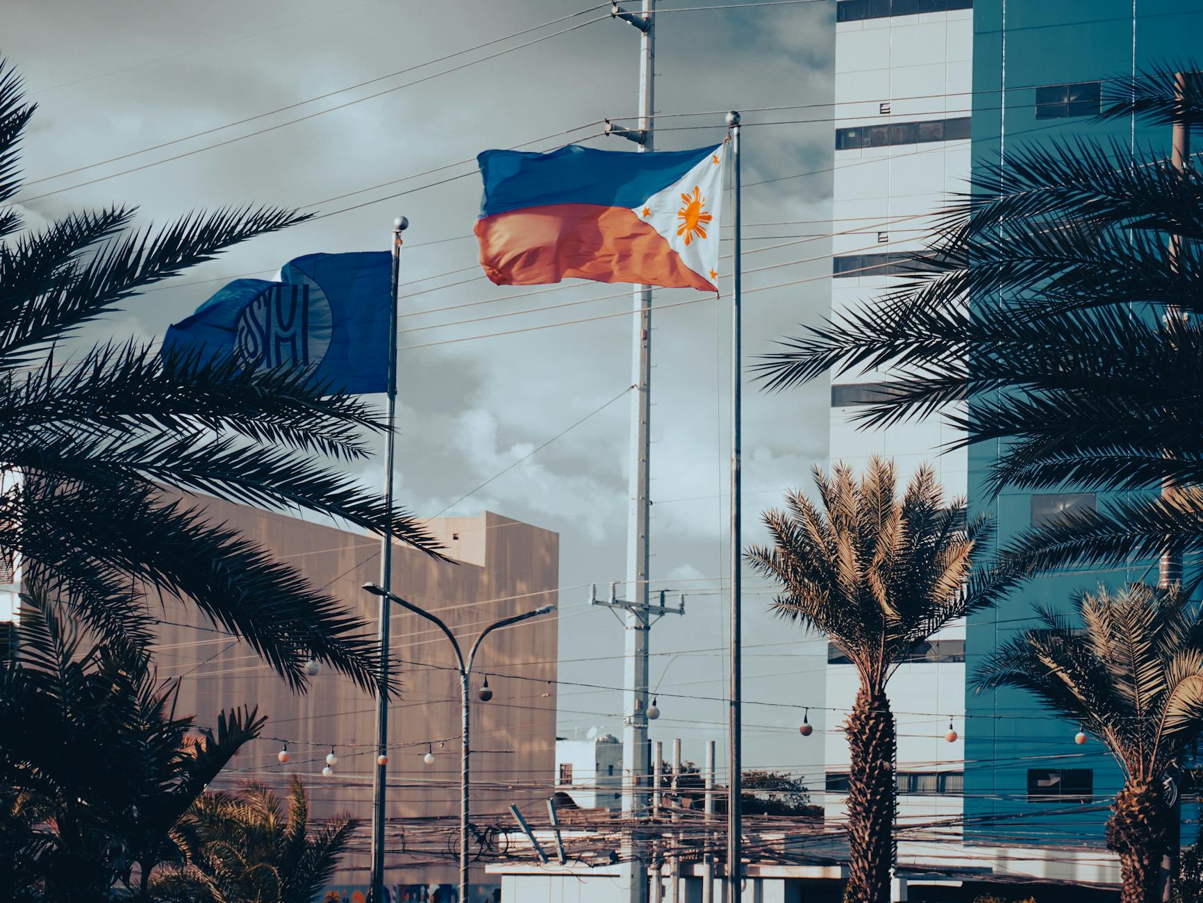 philippine and sm flags in urban setting