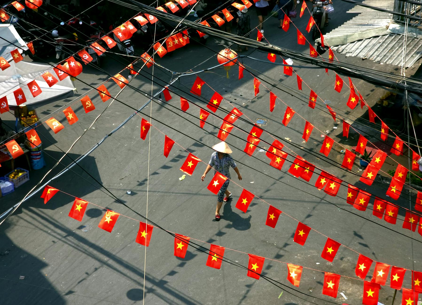 vietnam street with flags and conical hat
