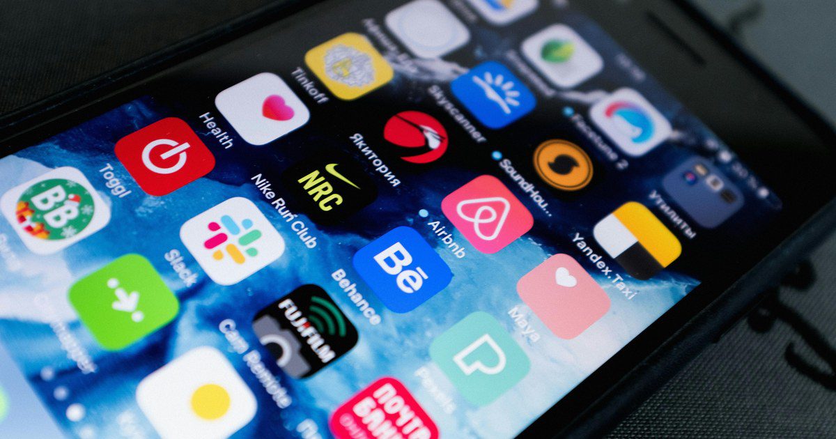 Detailed view of smartphone displaying multiple app icons on screen, highlighting technology use.