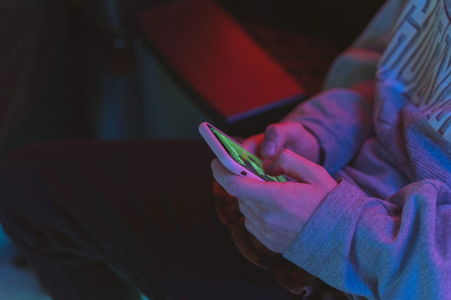 person holding white mobile phone